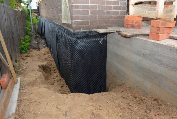 Happy homeowners after waterproofing job in Pimento